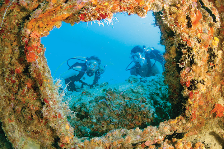 Scuba divers exploring the Eagle shipwreck