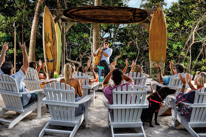 A musician performing outdoors for a crowd in Islamorada