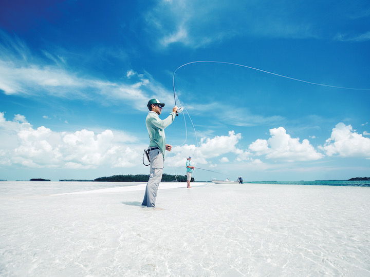 A man fly fishing on a sandbar in Key West