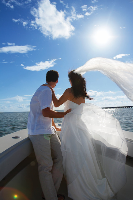 A bride and groom on a boat