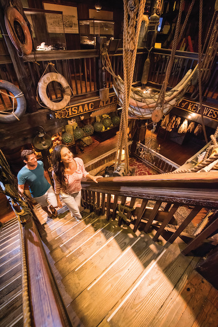 A couple walking up the stairs at the Key West Shipwreck Museum