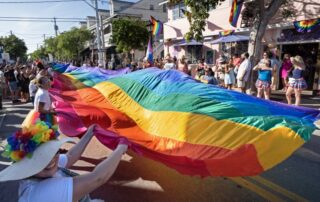 Marchers in the Sunday, June 29 Pride parade are to carry a 100-foot-long section of the iconic Sea-to-Sea flag that in 2003 stretched the entire 1.25 miles of Duval Street from the Atlantic to the Gulf. Photo: Florida Keys News Bureau