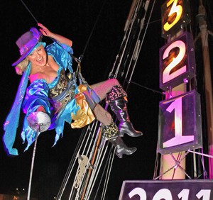 A "pirate wench" is lowered from the mast of a sailing vessel at the Schooner Wharf Bar to celebrate the arrival of the new year. (Photo by Daniel Kolbe, Florida Keys News Bureau)
