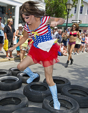 An entrant high-steps through tires during a past year's Great Conch Republic Drag Race, part of the annual Conch Republic Independence Celebration. (Photo by Rob O'Neal, Florida Keys News Bureau)