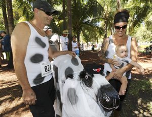 Jerry and Kate Motz (shown here with son Logan) dressed their twin babies in cow T-shirts and turned their double stroller into a perambulating cow for the offbeat "race." (All photos by Rob O'Neal, Florida Keys News Bureau)