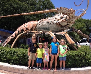 kids with giant lobster sculpture Islamorada Florida Keys