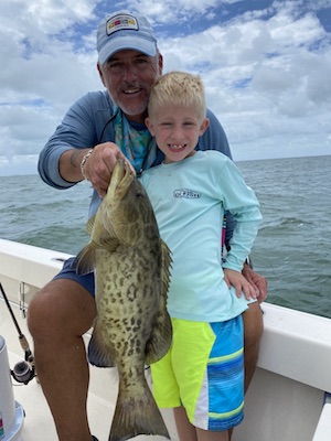 Fishing captain with child off Islamorada Florida Keys