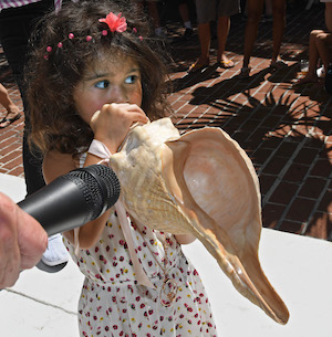 Little girl Key West Conch Shell Blowing Contest