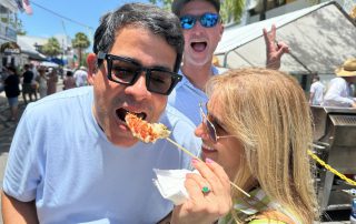 Woman feeding man Keys lobster