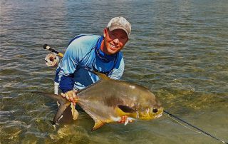 man releasing fish Florida Keys