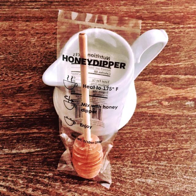 Keez Beez products include a honey dipper or swizzle stick for dissolving honey in hot beverages.