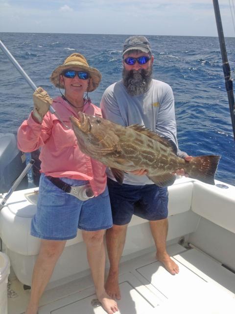 Dianne and Billy fish recreationally together in the Keys during their down time. The 5-foot-4-inch Harbaugh landed this nice sized grouper.