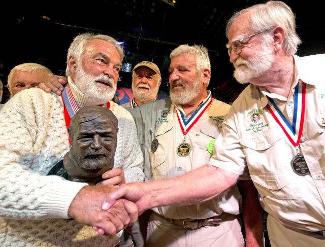 Scores of stocky, bearded men resembling Ernest Hemingway compete in the annual namesake Look-Alike Contest at Sloppy Joe’s Bar, a frequent hangout for the legendary writer.