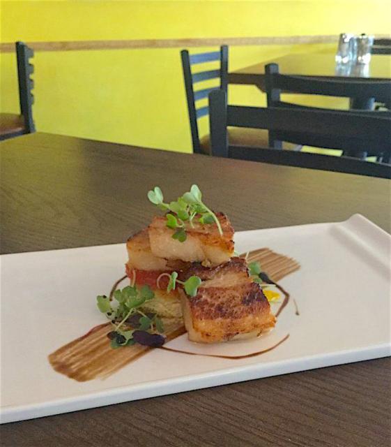 A popular appetizer at Milagro is wood grilled octopus, served atop applewood bacon polenta and sun dried tomato vinaigrette.