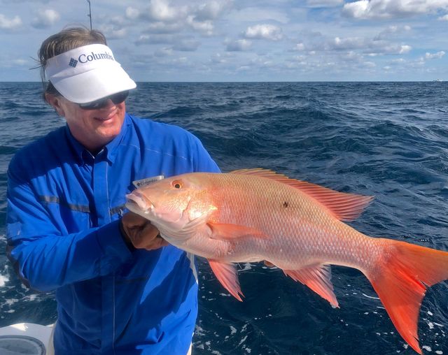 George Poveromo displays a nice mutton snapper he caught off Key Largo this past November, while shooting a television show in the Florida Keys