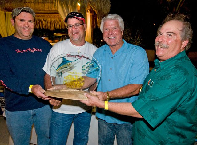 Coach Jimmy Johnson, second from right, has two passions: football and fishing.