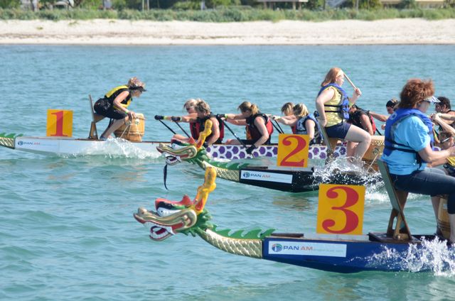 The 40-foot-long racing “dragons” are propelled in unison along a 400-meter racecourse, directed by a drummer and steerperson who keep rhythm.
