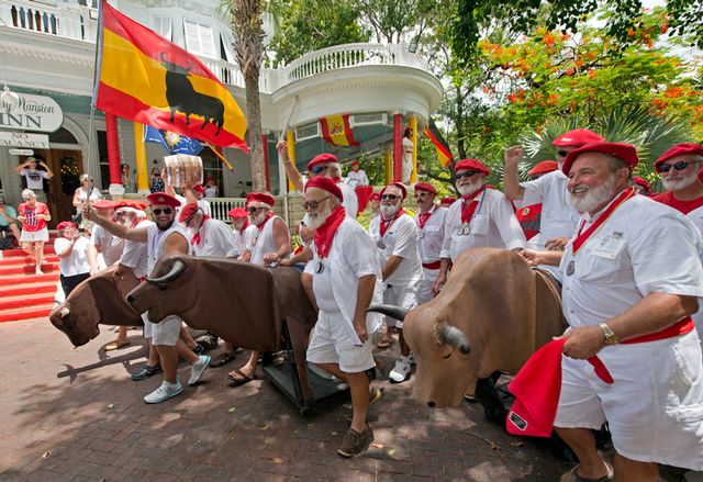Crowds of spectators gather for the quirky 'Running of the Bulls' reenactment. 