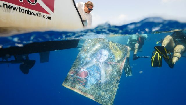 The submerged 24-piece 'Plastic Ocean Project' underwater art exhibit spent three months adhered to the hull of the Gen. Hoyt S. Vandenberg shipwreck. Images: Joe Berg/Way Down Video