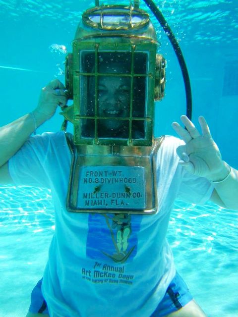 Wearing an early diving hood made by Miller Dunn Co., which manufactured the Mark V U.S. Navy diving helmet. Art McKee used one for salvage and treasure diving.