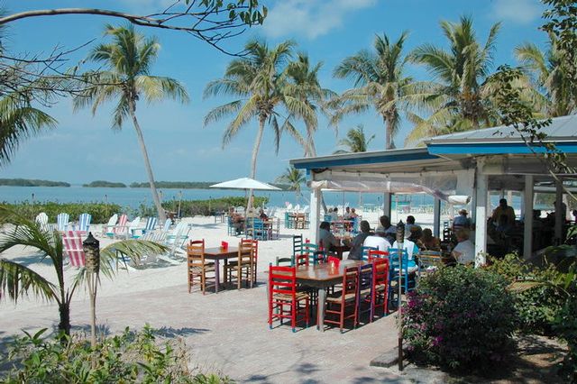 Dining outdoors with a view of the picturesque sunset is a signature Florida Keys experience.