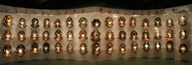 The Parade of Nations exhibit is a collection of 25 historic hard-hat dive helmets from around the world.