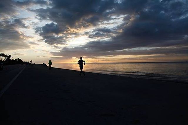 Runners at daybreak in Key West. Image: Rob O'Neal 