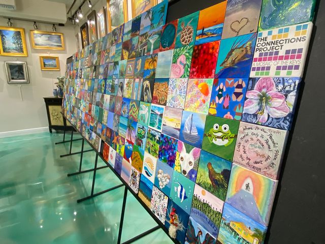 Individual canvases feature art in mediums including painting, photography, mixed media, beading and quilting