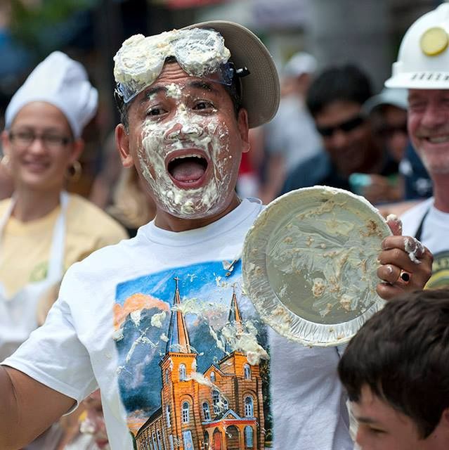 After donning safety goggles, pie-eating contest entrants must attempt to devour an entire 9-inch pie, topped with mountains of whipped cream, faster than the competition — without using their hands.
