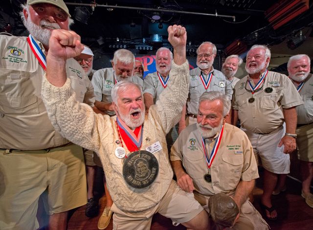 Joe Maxey, second from left, celebrates his victory at the 2019 Hemingway Look-Alike Contest at Sloppy Joe's Bar in Key West. Competing for the eighth time, Maxey beat 141 other contestants to claim top honors.