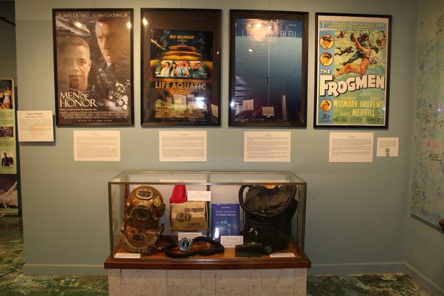 The exhibit also pays homage to famed diving pioneers such as Jacques Cousteau, whose recognizable red hat and early diving regulator are pictured here.