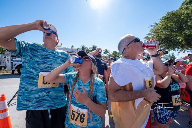 Beach N' Beer Mile runners must consume four beers over a 1-mile course. Organizers said the fastest time that chugging joggers need to beat is seven minutes. 