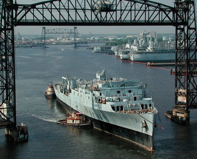 The massive ship was towed along the James River in Norfolk, Virginia, after a 12-year stint in a mothball fleet of the U.S. Navy's decommissioned ships. 