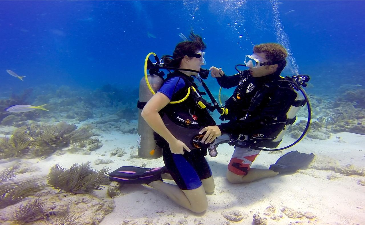 A diver is counseled by a dive instructor during a refresher course off the Florida Keys. The Florida Keys tourism council has released a new dive safety video with important health and safety information presented by Keys dive experts.