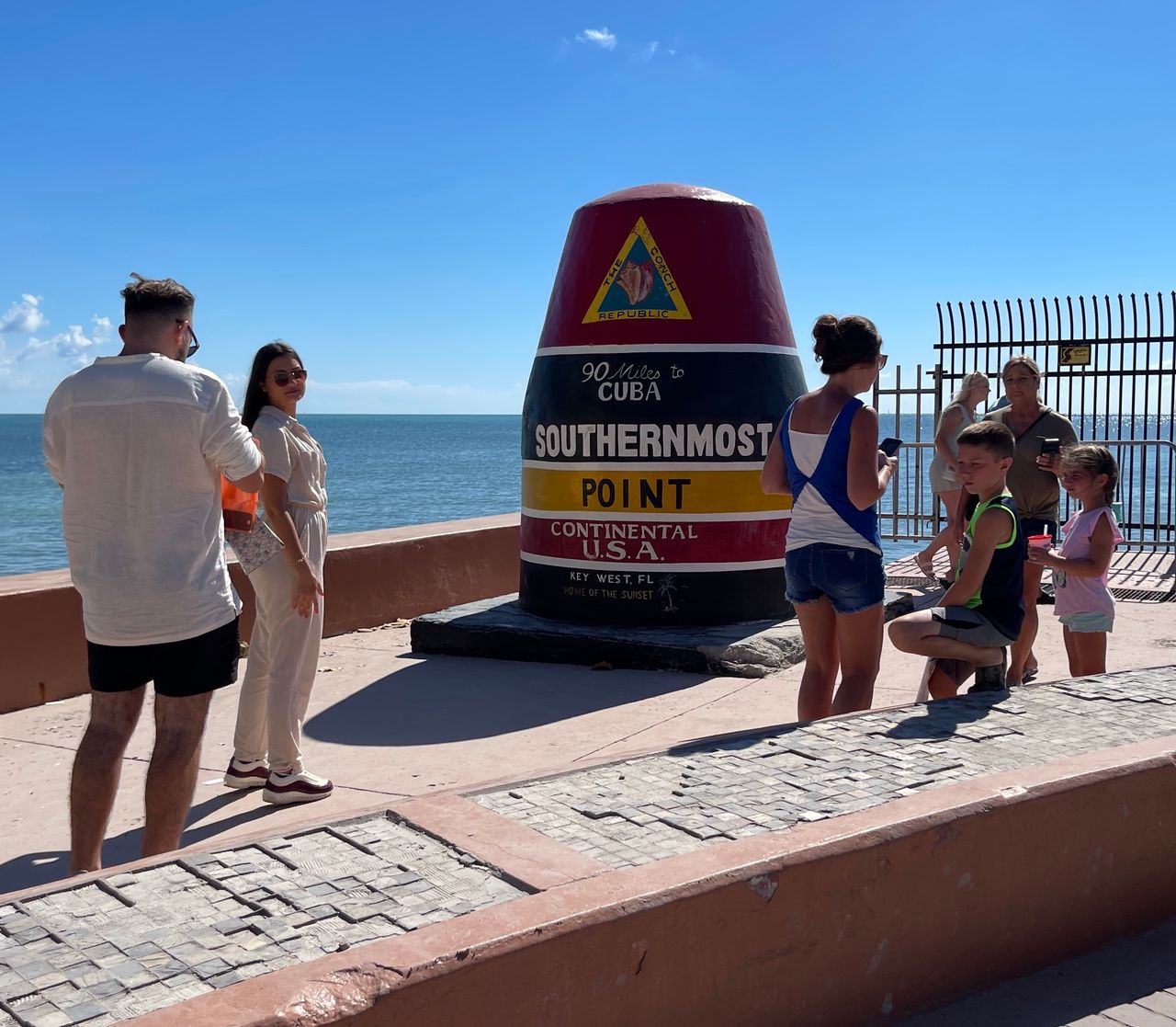 People take pictures at Key West's Southernmost Point marker Oct. 4. Photo: Rob O'Neal