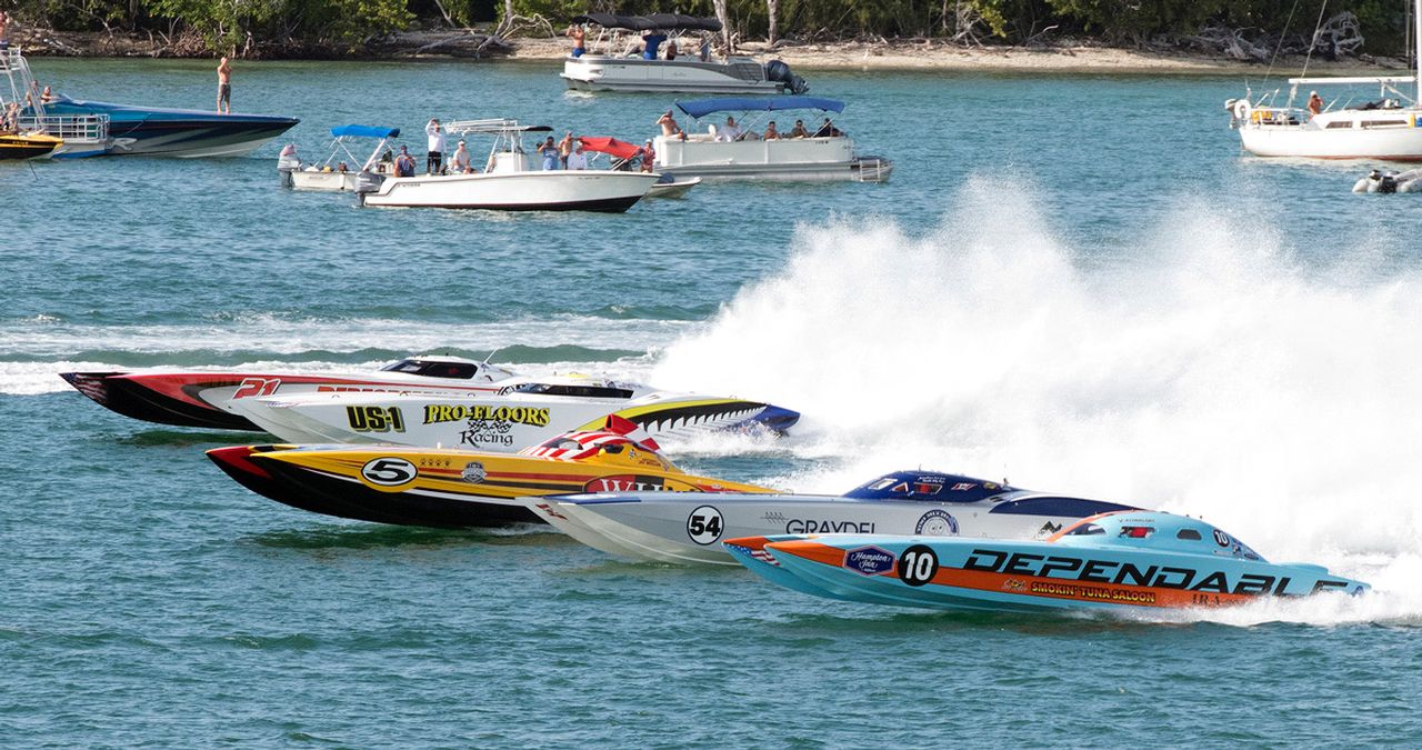 Offshore raceboats cross the start line during the first day of competition at the 2021 Race World Offshore Key West Championships in Key West, Fla. 