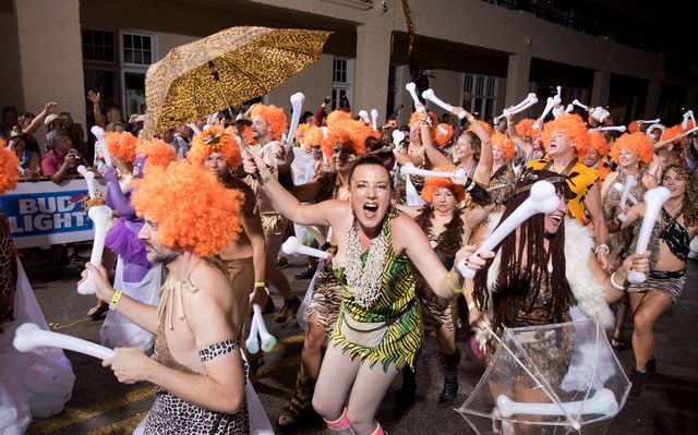 Revelers portraying the Flintstones animated series dance down Duval Street in a past year's Fantasy Fest parade in Key West, Fla. Photo: Rob O'Neal/Florida Keys News Bureau 