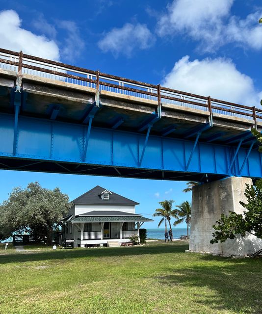 One of the restored historic structures on Pigeon Key is seen under the newly renovated Old Seven Mile Bridge. Photo by JoNell Modys