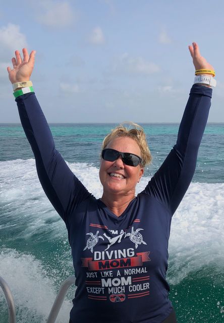 The mother of two grown sons, Lisa gives back by leading ocean and beach cleanup efforts and capturing and removing invasive lionfish from Keys waters.