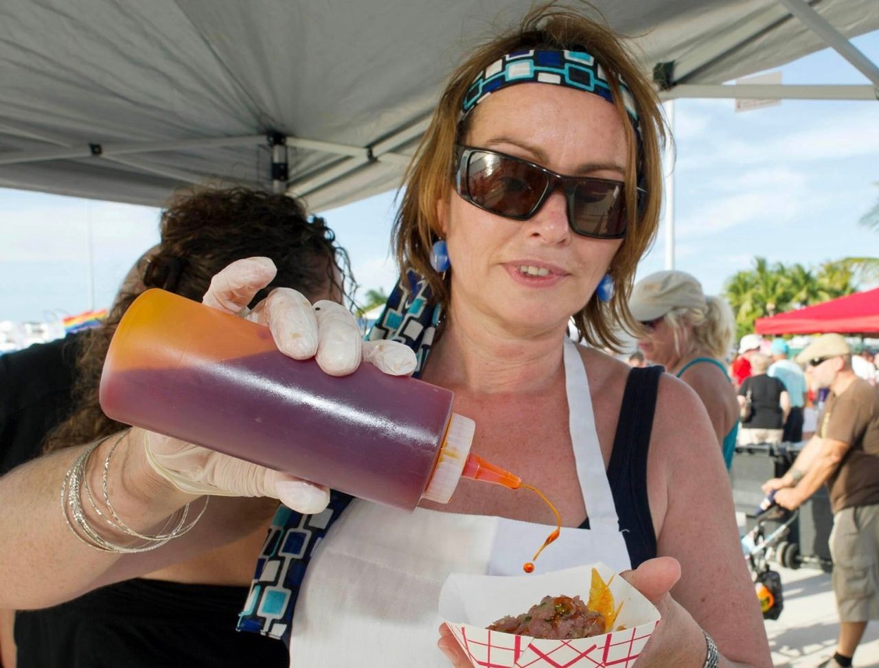 Maria Wevers serves up tasty bites from Grand Cafe at a local food festival. Photo: Rob O'Neal