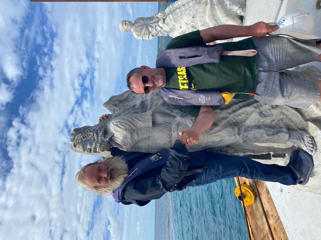 David Vaughan with artist Jason deCaires Taylor as his Ocean Sentinel statue is prepared for lowering onto the MOUA section of the Great Barrier Reef. 