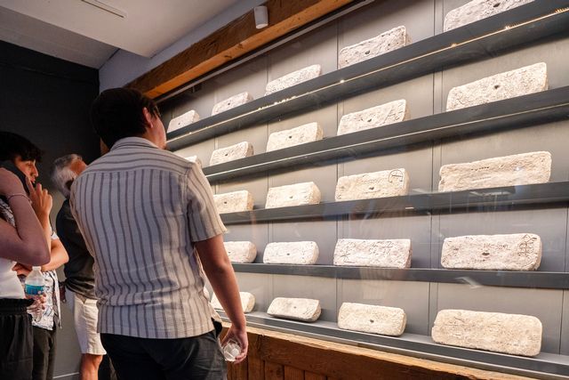 Visitors to Key West's Mel Fisher Maritime Museum view a display of 24 silver bars weighing about 70 pounds apiece. Photo courtesy of Mel Fisher Maritime Museum