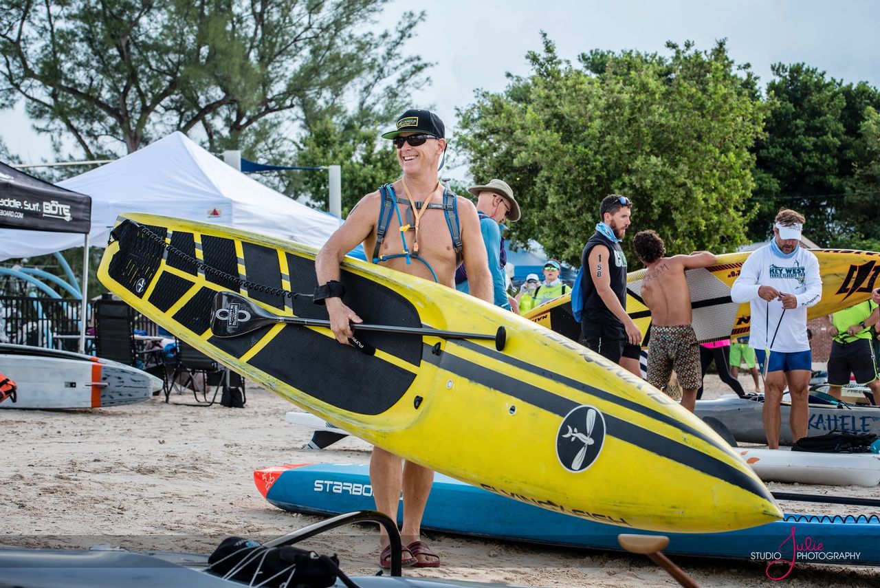 Paddlers on paddleboards, kayaks and other craft follow a 12-mile open-water course in the annual Key West Paddle Classic. 