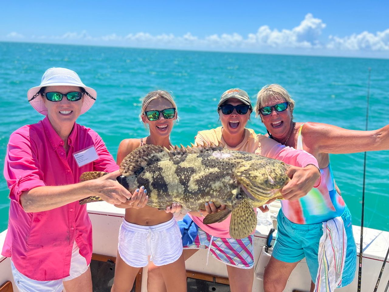 Female anglers celebrate a big inshore catch during a Ladies, Let's Go Fishing event in Islamorada. Photo by LLGF.