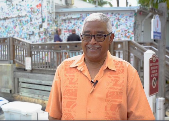 Key West City Commissioner Clayton Lopez remembers Buffett and his impact on the city of Key West while standing outside Shrimp Boat Sound studios. Photo: Landon Jones