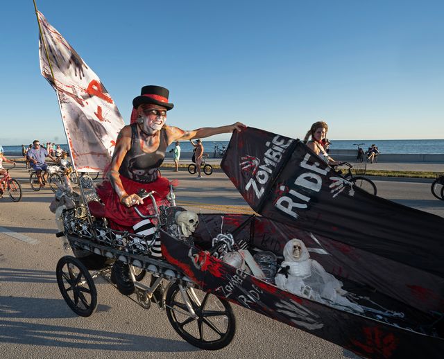 A zombie propels a casket during Key West's annual Zombie Bike Ride. 