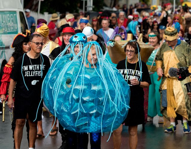 Women dressed as jellyfish make their way down Fleming street during the Masquerade March, a highlight of the annual Fantasy Fest. Photo: Rob O'Neal