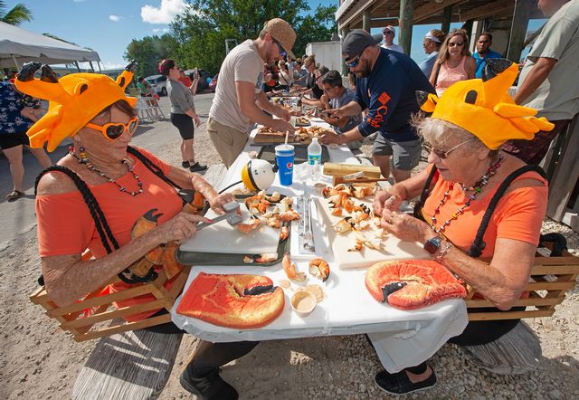 Sandra Bradshaw, left, and Sally Mishmash regularly compete in the team division of the annual Keys Fisheries Stone Crab Eating Contest. Photo: Andy Newman 