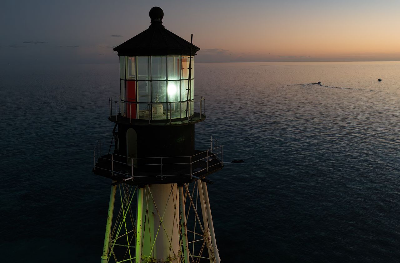 Alligator Reef Lighthouse is shining once again at night after have been dark for the past 10 years. The shining light is a reminder to the community of the need to fund the light's preservation. Photo: Andy Newman 