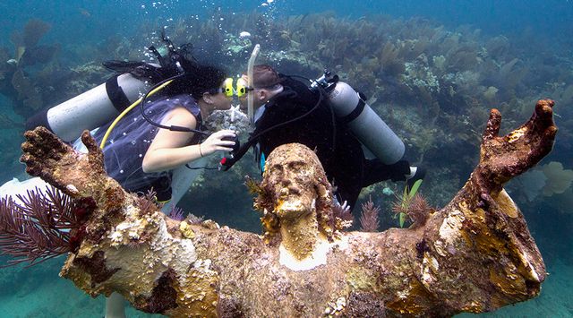 The Christ of the Deep statue, one of the most photographed underwater sites in the world, is a popular spot for undersea weddings. Photo: Bob Care